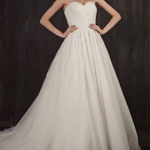 Not altered. Worn once, dry cleaned and In display box, smoke free home.